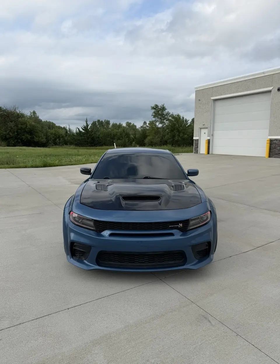 Blue Dodge Charger Scat Pack with tinted windows